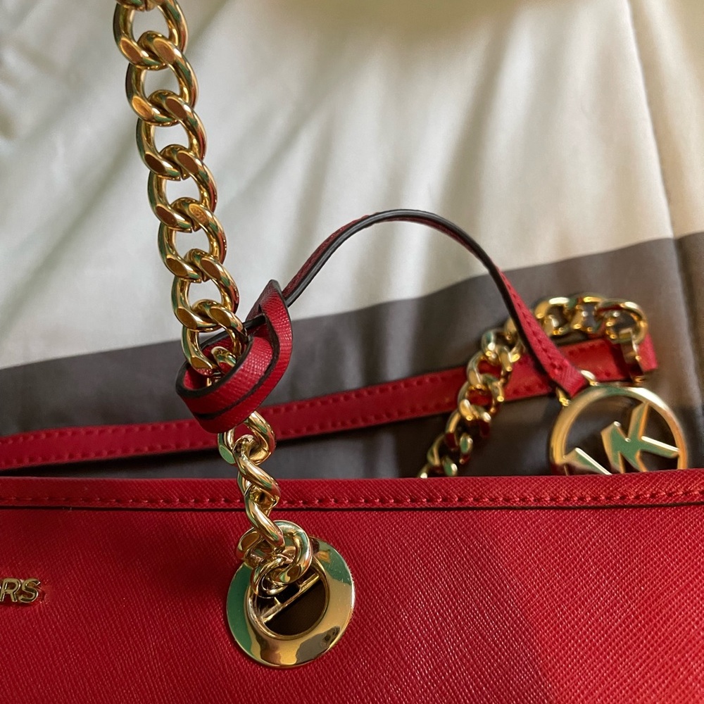 Dark brown with light brown MK accents, red trim, beautiful gold chain handles.